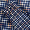 Close-up of Mineral Justin Check Shirt navy cuff buttoned