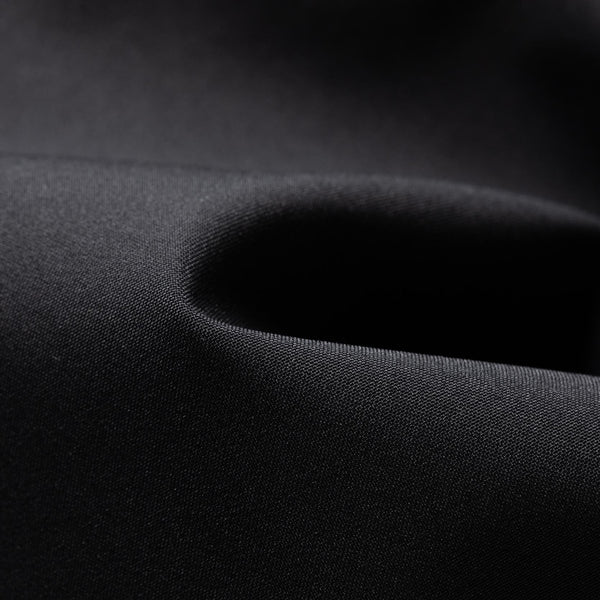 Close-up of black ARED waterproof stretch fabric used in Dare2b Achieve III ski trousers
