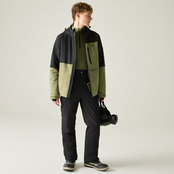 Full-length model wearing Dare2b Halfpipe IV Olive ski jacket with black ski trousers
