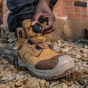 DeWalt Foundry Wheat waterproof BOA safety boot being adjusted on a building site