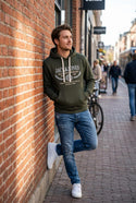 Man wearing Jack& Jones Frederiksberg Hoodie leaning against a wall