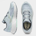 Light blue running shoes with white soles on a light gray background