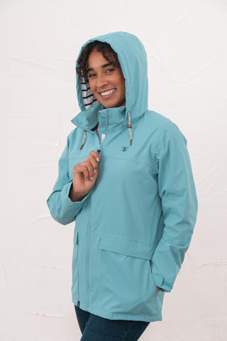 Lighthouse Beachcomber Ladies Waterproof Jacket | Lightweight Raincoat - Borderland Muff - blue