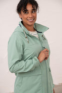 Lighthouse Beachcomber Ladies Waterproof Jacket | Lightweight Raincoat - Borderland Muff-green