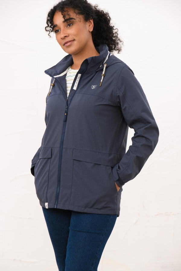 Lighthouse Beachcomber Ladies Waterproof Jacket | Lightweight Raincoat - Borderland Muff - navy