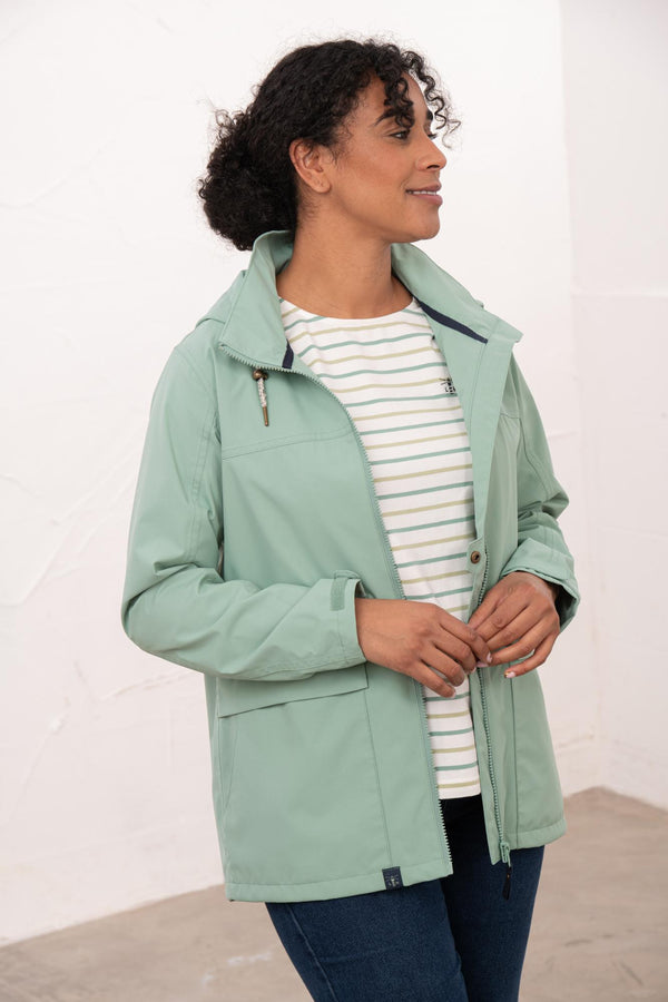 Lighthouse Beachcomber Ladies Waterproof Jacket | Lightweight Raincoat - Borderland Muff - green