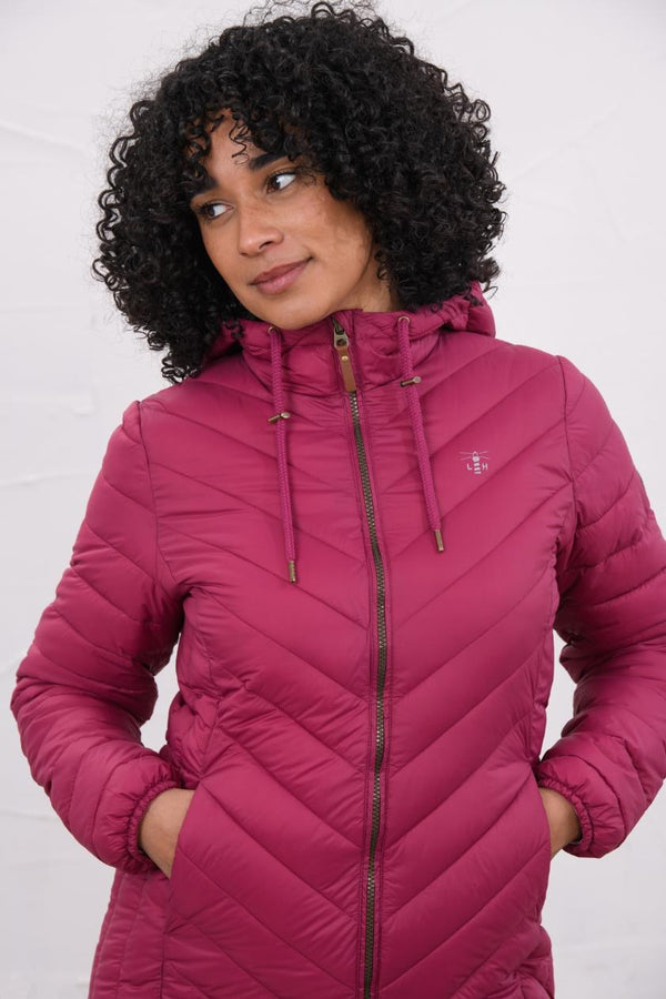 Woman wearing Lighthouse Laurel Berry coat in three-quarter front view