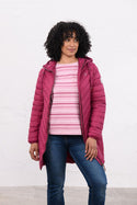 Woman wearing Lighthouse Laurel Berry coat open over a striped top