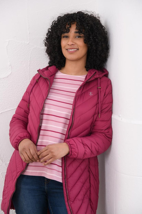 Woman wearing Lighthouse Laurel Berry coat open over striped top
