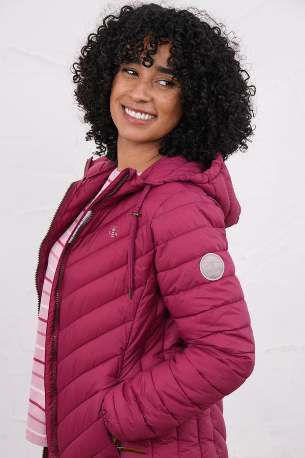 Woman wearing Lighthouse Laurel Berry coat open at the front