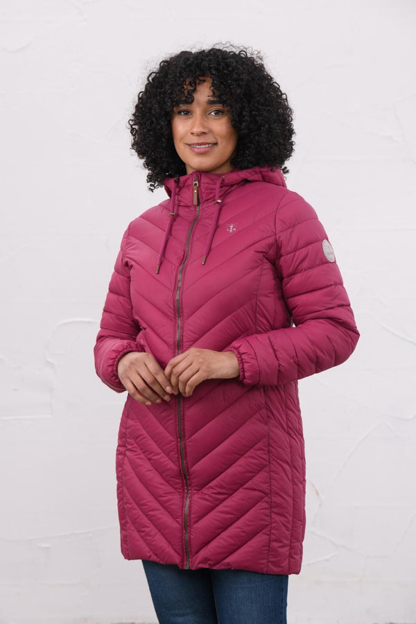 Woman wearing Lighthouse Laurel Berry coat in three-quarter front view