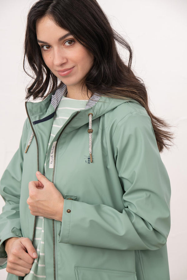 Lighthouse Lucy Long Ladies Showerproof Jacket | Rubberised Raincoat - Borderland Muff