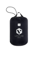 Mac in a Sac Nova women’s Jet Black down jacket packed in the storage bag
