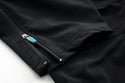 Close-up of a black trouserst with ankle zipper on a white background