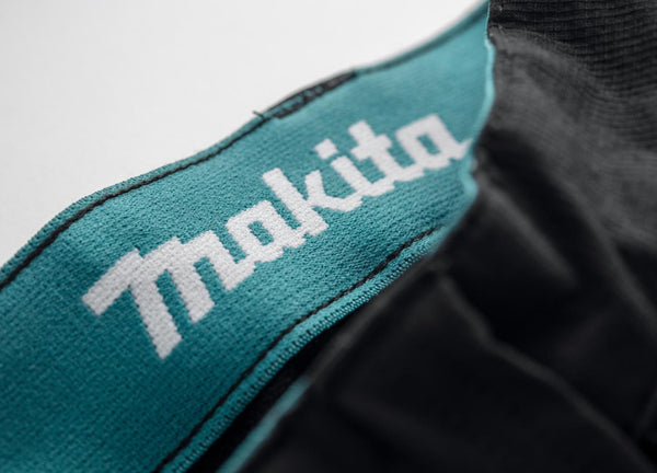 Makita Onyx Stretch Trousers MK304M slim fit work trousers with holster pockets logo hem