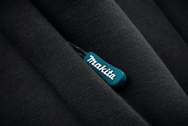 Makita logo on a black fabric background