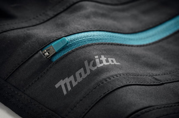 Heavy-duty YKK zip and rubberised button fastening on Makita work trousers