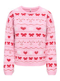 ONLY Snowie Christmas knitted jumper in pink with red bows, hearts and candy cane pattern, front view
