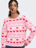 Close-up of pink ONLY Snowie jumper showing crew neckline and festive pattern
