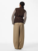Model wearing PIECES Katty Hot Fudge teddy gilet, rear styling view

