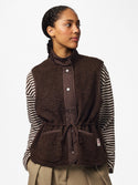 Model wearing PIECES Katty Hot Fudge teddy gilet with striped top and adjustable drawstring waist
