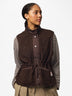 Model wearing PIECES Katty Hot Fudge teddy gilet with striped top and adjustable drawstring waist
