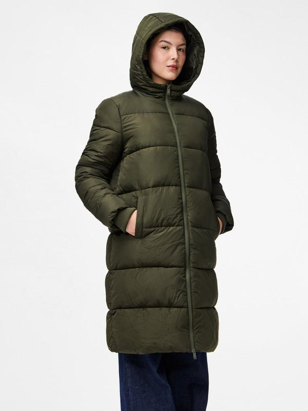 Person wearing a green puffer coat on a white background