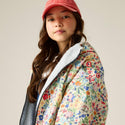 Cath Kidston kids waterproof changing robe in Cream Ditsy worn by model