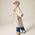 Cath Kidston kids waterproof changing robe in Cream Ditsy worn by model