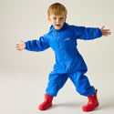 Child wearing Regatta Splosh III Oxford Blue waterproof suit with red wellies