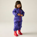 Child wearing Regatta Splosh III Peony waterproof suit with red wellies